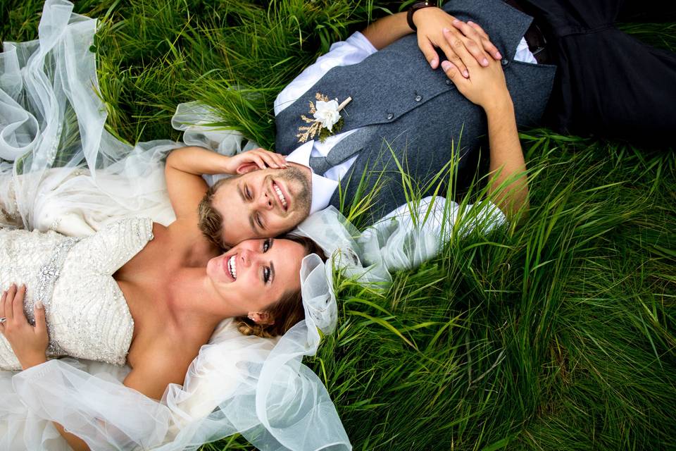 Bride and Groom laying down