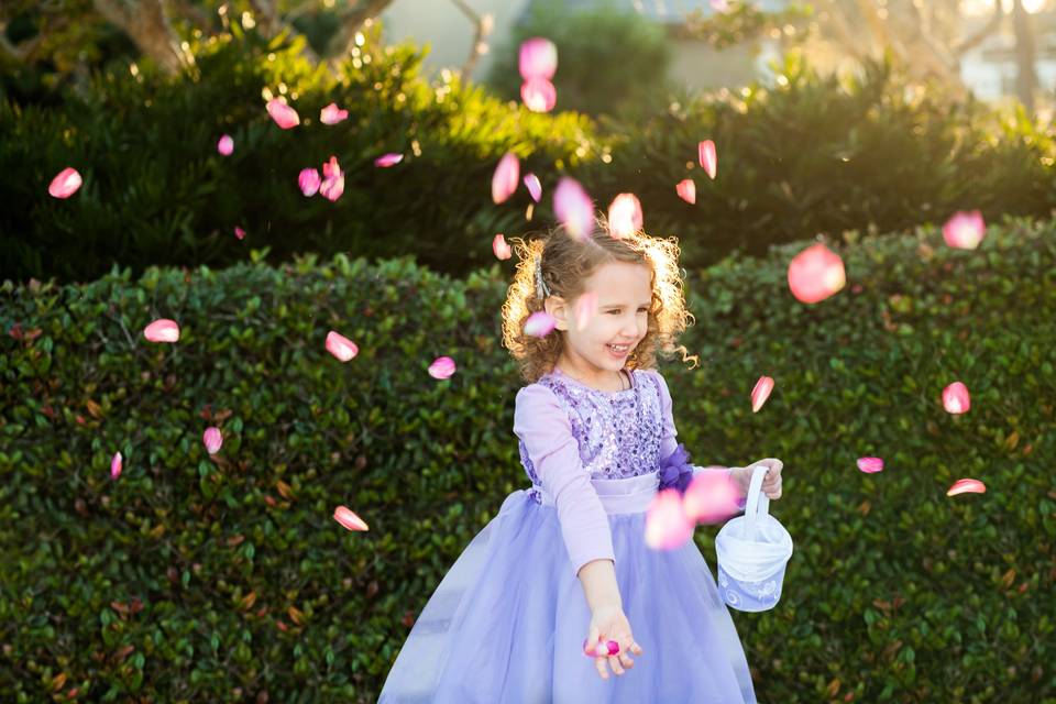 Flower girl tossing petals