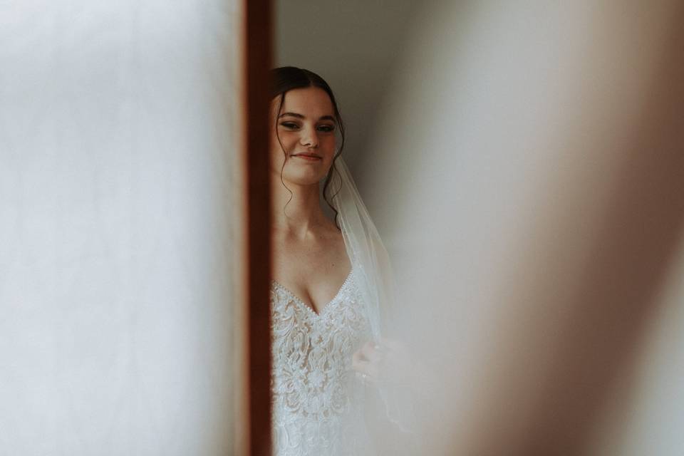 Bride looking in mirror