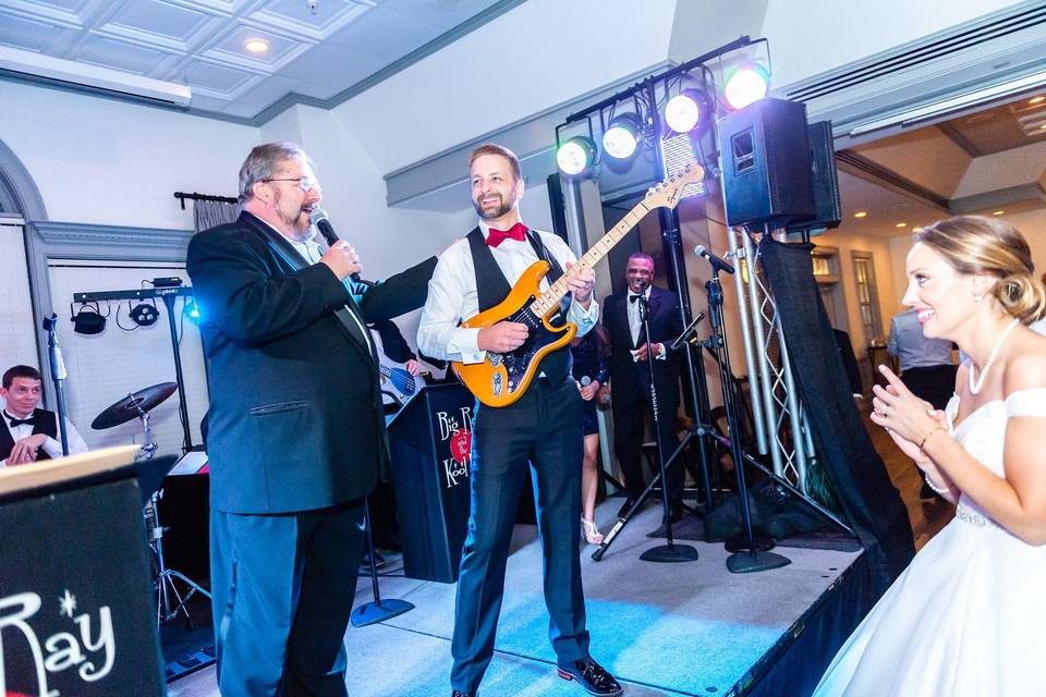 Groom serenades the bride