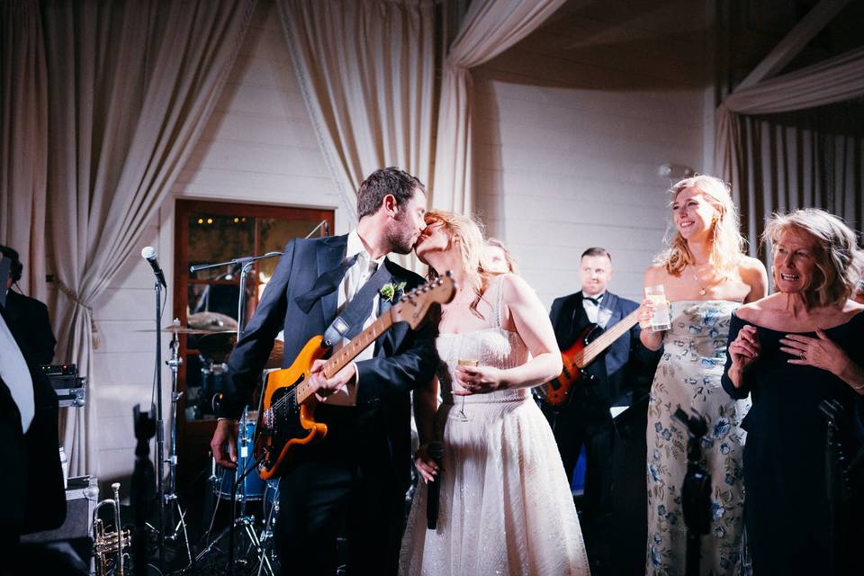 Groom Playing Guitar for Bride