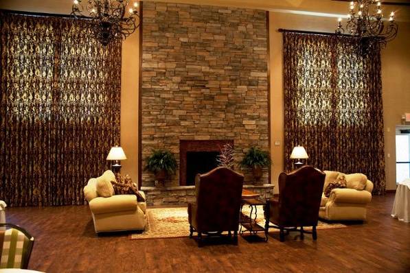 Grand Ballroom featuring a Stone-Wall Fireplace and Sitting Area.