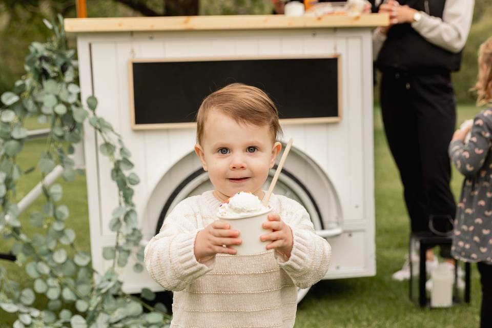 Child with scoop of ice cream