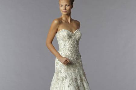 Style 32777716 This a-line gown features a sweetheart neckline with a dropped waist in beaded embroidery and tulle. It has a sweep train. This gown is Exclusive to Kleinfeld Bridal.