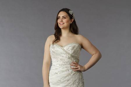 Style 32569246  This a-line gown features a sweetheart neckline with an asymmetric waist in beaded embroidery and tulle. It has a sweep train. This gown is available in Plus Sizes, and is Exclusive to Kleinfeld Bridal.