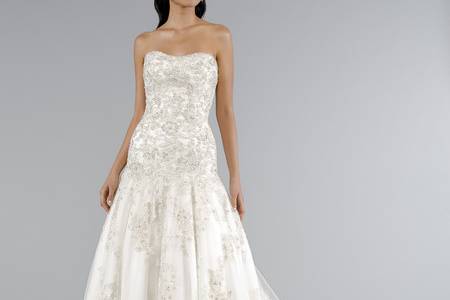 Style 32950271  This a-line gown features a strapless neckline with in beaded lace and organza. It has a chapel train. This gown is Exclusive to Kleinfeld Bridal.