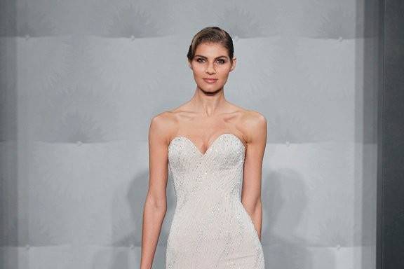 Style 32614190  This mermaid gown features a sweetheart neckline with a dropped waist in silk and beaded embroidery. It has a chapel train. This gown is Exclusive to Kleinfeld Bridal.