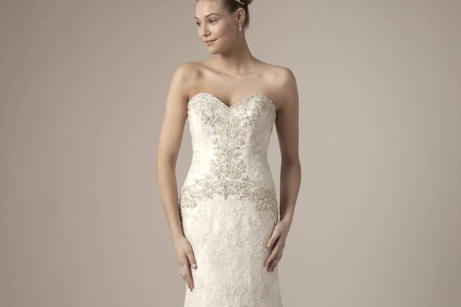 Style 32562399 This mermaid gown features a sweetheart neckline with in alencon lace and beaded embroidery. It has a chapel train. This gown is Exclusive to Kleinfeld Bridal.
