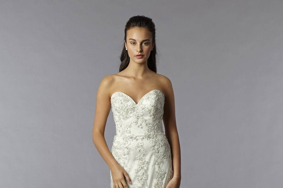 Style 32561482  This sheath gown features a sweetheart neckline with a natural waist in beaded lace and tulle. It has a chapel train. This gown is Exclusive to Kleinfeld Bridal.