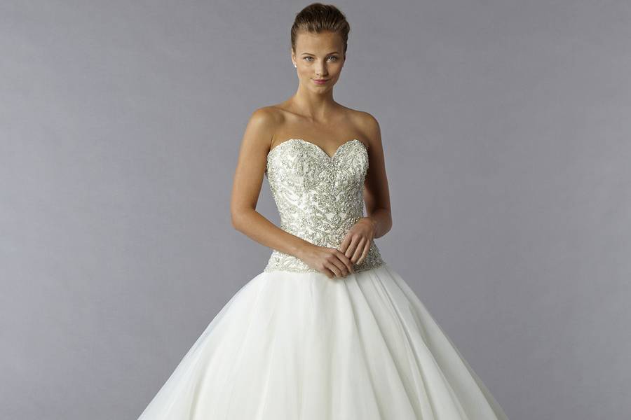 Style 32769598  This ball gown features a bateau neckline with a natural waist in tulle and beaded embroidery. It has a sweep train and cap sleeves. This gown is Exclusive to Kleinfeld Bridal.