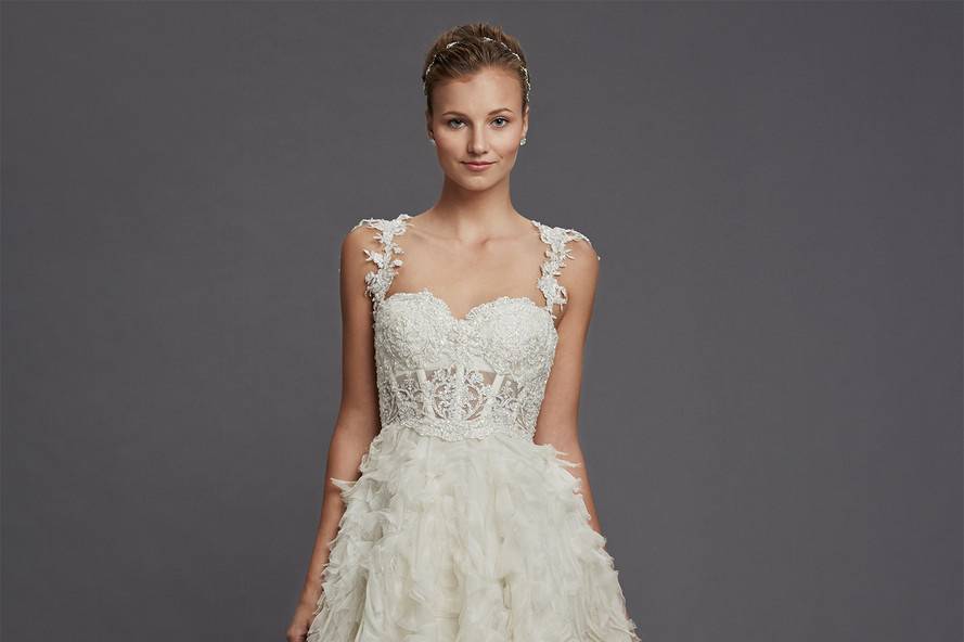 Style 32815599  This a-line gown features a sweetheart neckline with a natural waist in organza and beaded lace. It has a chapel train and cap sleeves. This gown is Exclusive to Kleinfeld Bridal.