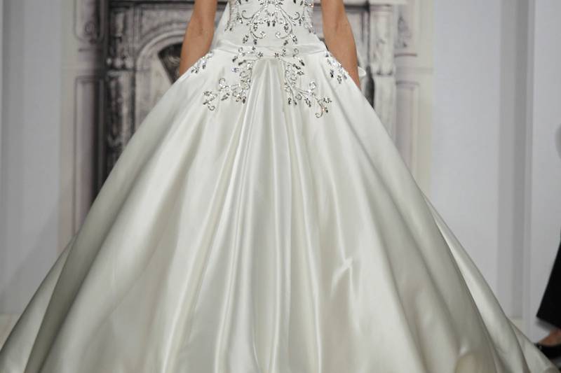 Style 32813750  This ball gown features a sweetheart neckline with a natural waist in silk satin and beaded embroidery. It has a chapel train. This gown is Exclusive to Kleinfeld Bridal.
