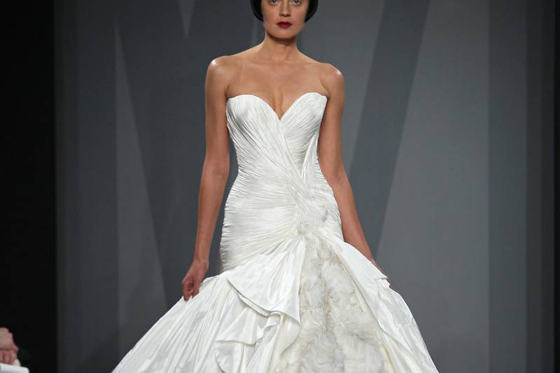 Style 32818049  This ball gown features a sweetheart neckline with a dropped waist in silk taffeta and silk organza. It has a chapel train. This gown is Exclusive to Kleinfeld Bridal.