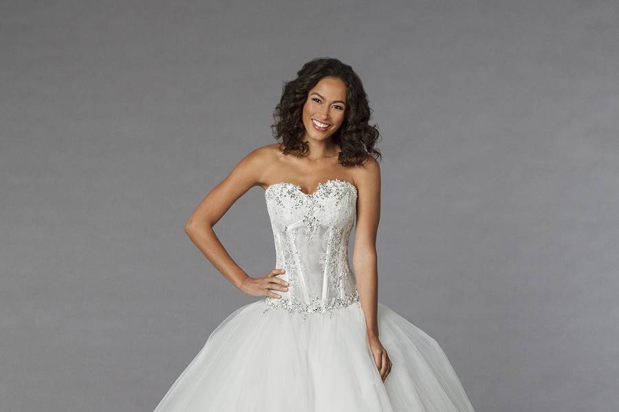 Style 32848210  This ball gown features a sweetheart neckline with a dropped waist in tulle and beaded lace. It has a chapel train. This gown is Exclusive to Kleinfeld Bridal.