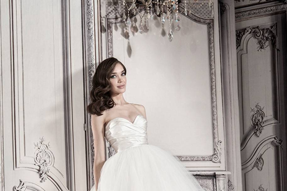 Style 32848160 This sheath gown features a sweetheart neckline with a natural waist in lace. It has a chapel train. This gown is Exclusive to Kleinfeld Bridal.