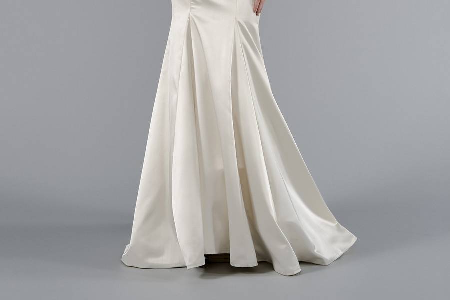 Style 33029034  This sheath gown features an illusion neckline with in silk satin and embroidery. It has a chapel train and a tank top. This gown is Exclusive to Kleinfeld Bridal.