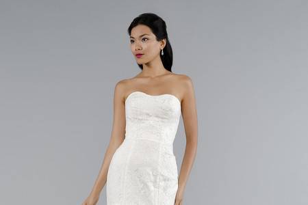 Style 33012113 This sheath gown features a strapless neckline with in lace. It has a chapel train. This gown is Exclusive to Kleinfeld Bridal.