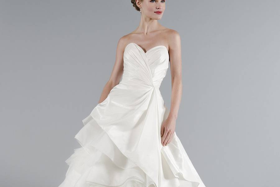 Style 33012063  This a-line gown features a sweetheart neckline with an asymmetric waist in silk taffeta. It has a chapel train. This gown is Exclusive to Kleinfeld Bridal.