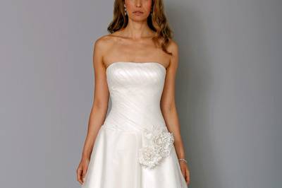 Style 32729907This a-line gown features a strapless neckline with a natural waist in silk. It has a chapel train. This gown is Exclusive to Kleinfeld Bridal.