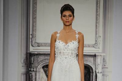 Style 32813636 This sheath gown features a sweetheart neckline with a natural waist in tulle and beaded embroidery. It has a sweep train and spaghetti straps. This gown is Exclusive to Kleinfeld Bridal.
