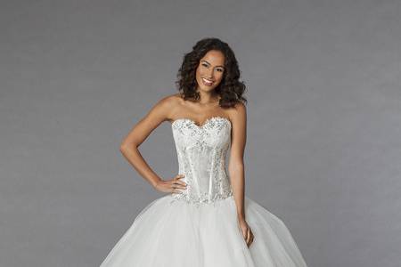 Style 33029398 This ball gown features a sweetheart neckline with an empire waist in organza. It has a chapel train. This gown is Exclusive to Kleinfeld Bridal.