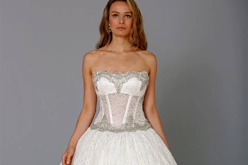 Style # 32708950This ball gown features a strapless neckline with a natural waist in lace and beaded embroidery. It has a chapel train. This gown is Exclusive to Kleinfeld Bridal.