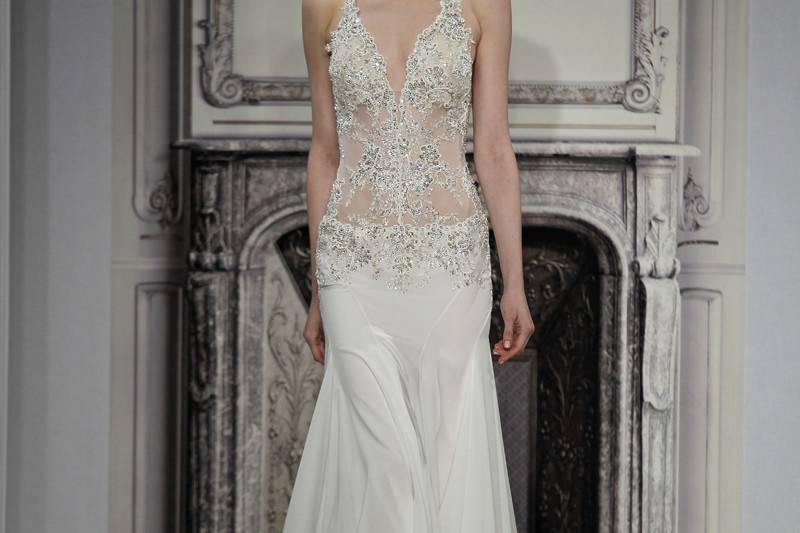 Style # 32813354This sheath gown features an halter neckline with a dropped waist in silk charmeuse and beaded embroidery. It has a sweep train and a tank top. This gown is Exclusive to Kleinfeld Bridal.
