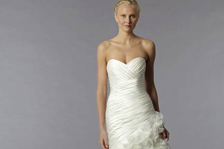 Style 32593634This a-line gown features a strapless neckline with a natural waist in silk satin and beaded embroidery. It has a chapel train. This gown is Exclusive to Kleinfeld Bridal.