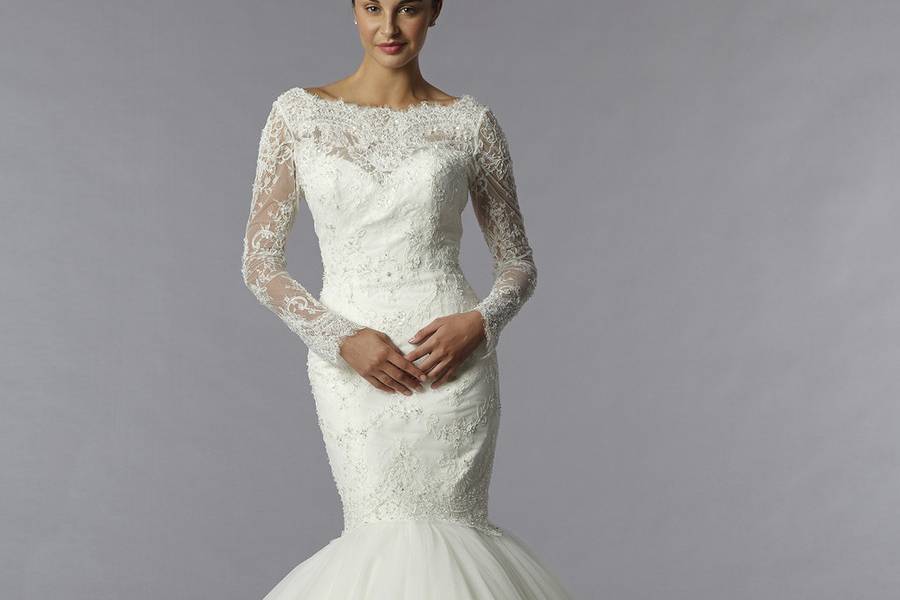 Style 32699001This mermaid gown features a bateau neckline with in lace and tulle. It has a sweep train. This gown is Exclusive to Kleinfeld Bridal.