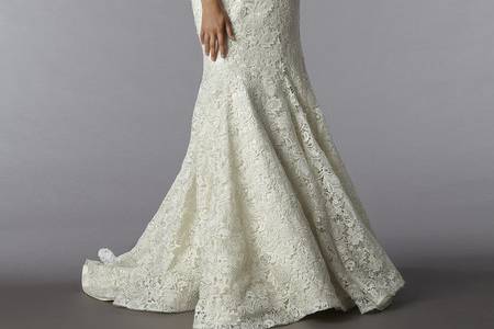 Style 32679821This mermaid gown features a strapless neckline with in lace. It has a chapel train. This gown is Exclusive to Kleinfeld Bridal.