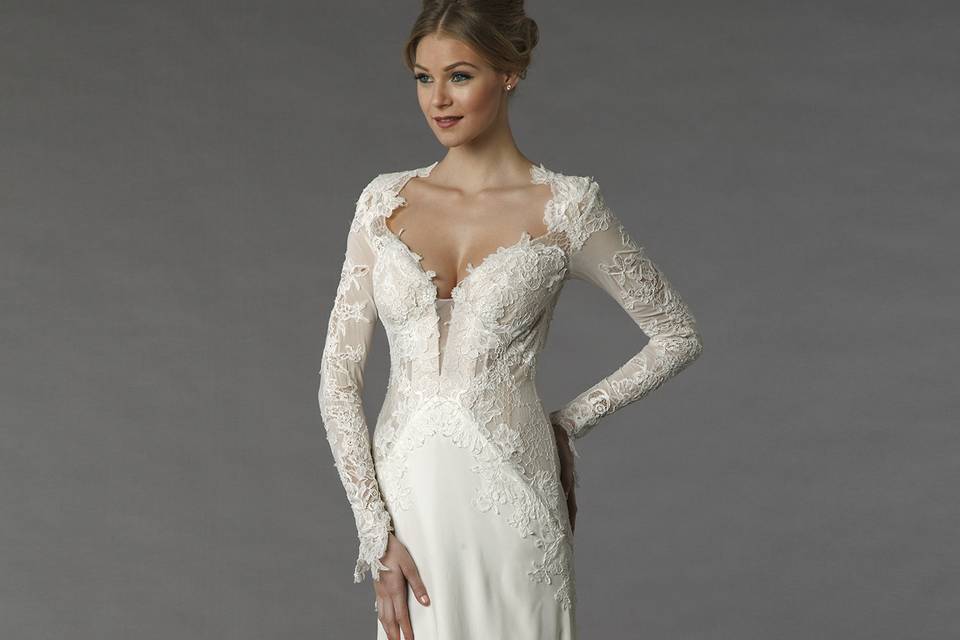 Pnina Tornai 4331		This a-line gown features a sweetheart neckline with a natural waist in silk organza and lace. It has a chapel train and long sleeves. This gown is Exclusive to Kleinfeld Bridal.