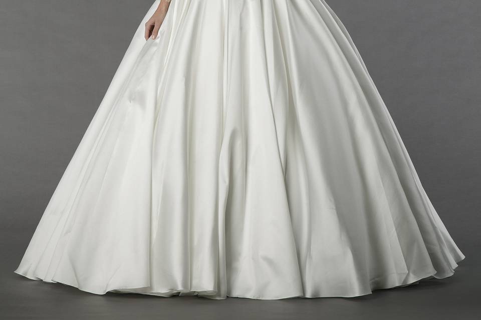 Tony Ward 26V2		This ball gown features an illusion neckline with a natural waist in silk satin and lace. It has a sweep train and long sleeves.
