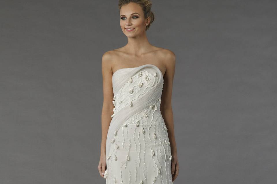 Tony Ward 37S12		This a-line gown features a strapless neckline with a natural waist in chiffon and beaded embroidery. It has a chapel train.