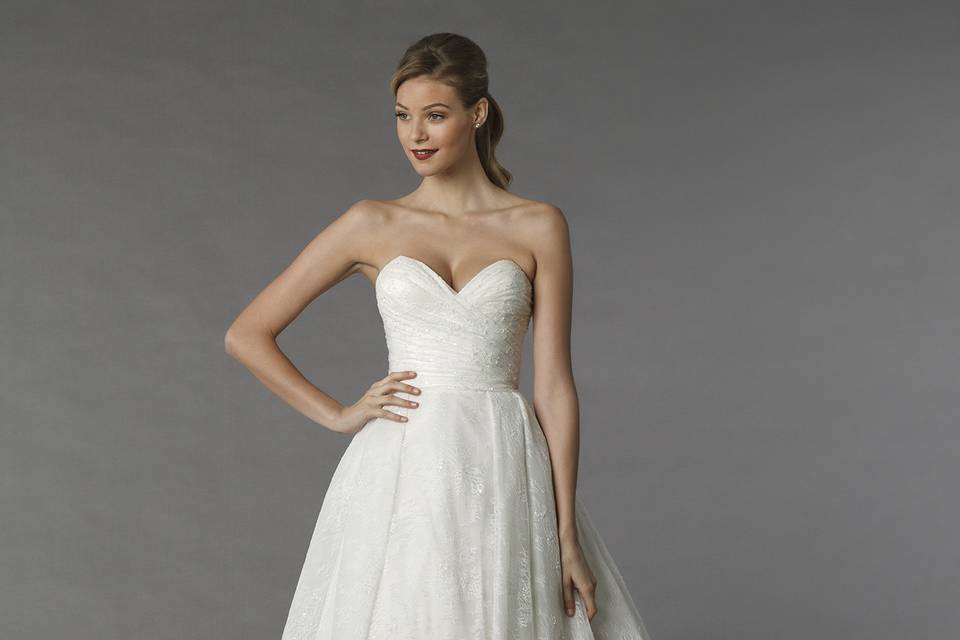 Style	14031		This a-line gown features a sweetheart neckline with a natural waist in lace. It has a chapel train.