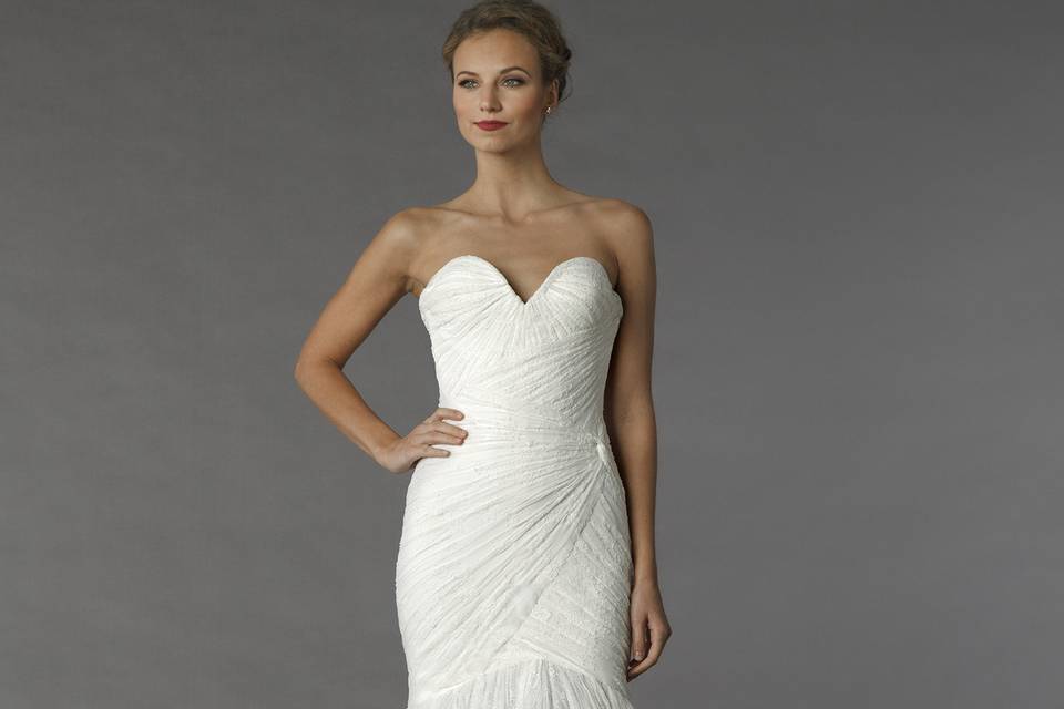 Style	95		This mermaid gown features a sweetheart neckline with a dropped waist in lace. It has a chapel train.