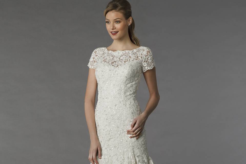 MZ2 74555  This a-line gown features a sweetheart neckline with in beaded lace. It has a chapel train and spaghetti straps.