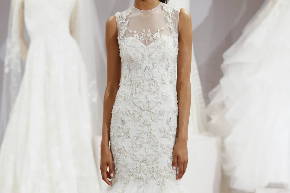 Tony Ward for Kleinfeld	Angelica 		Off white mermaid gown with embroidered tulle and lace and a sheer neckline.