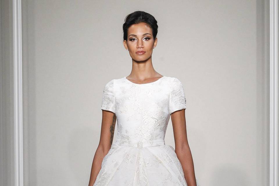 Style	MILAN  Ivory silk brocade ball gown with short sleeves and a pleated skirt.
