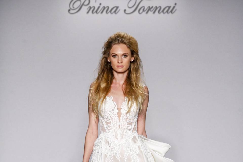 Pnina Tornai Style 4443  Ivory satin organza ball gown with natural waist, cap sleeves, lace appliques and lace bow on back.