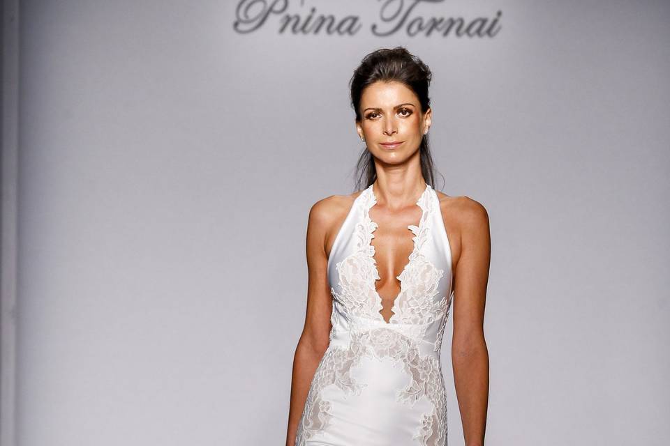 Pnina Tornai Style 4457  Ivory Chantilly lace fit-and-flare with deep v-neck halter, low back, and romantic appliques.