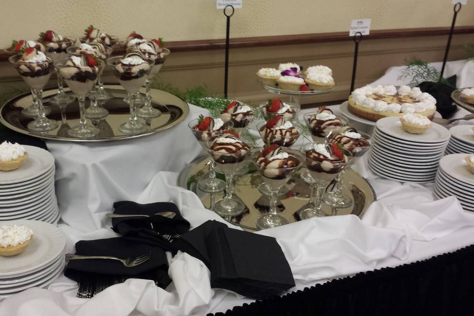 Brownie Mousse and Mini Tarts at a dessert station.