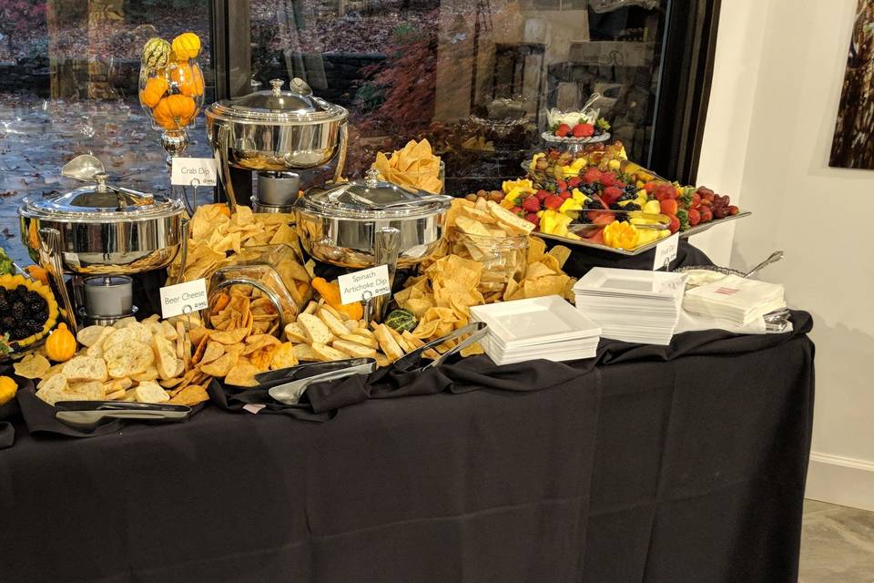 A hot dip bar display table with upscale disposables.