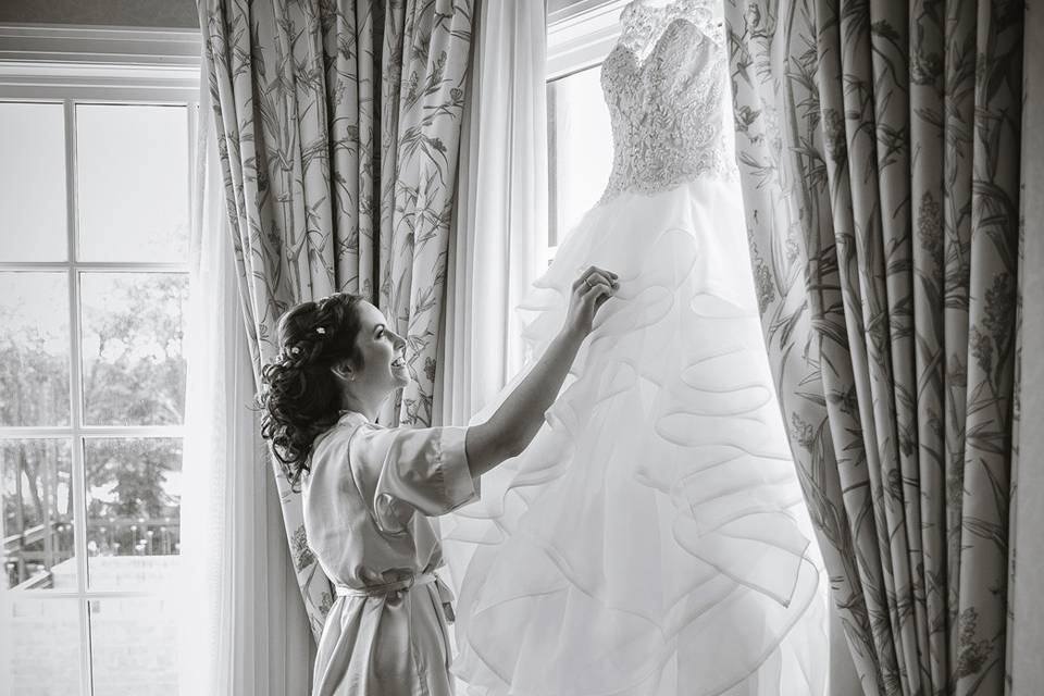 Admiring the wedding gown
