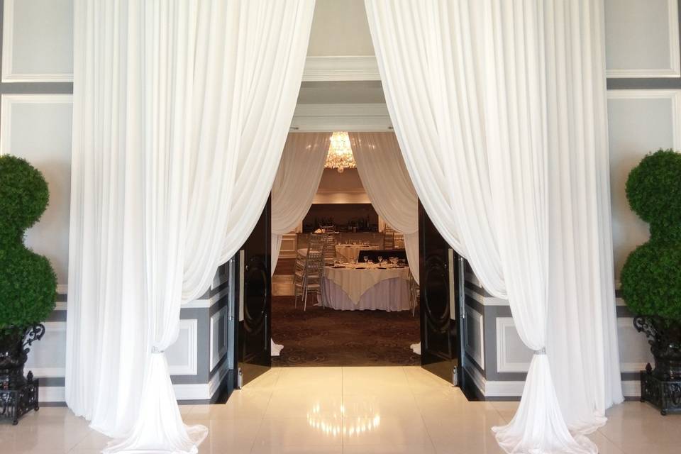 Grand entrance with white draping