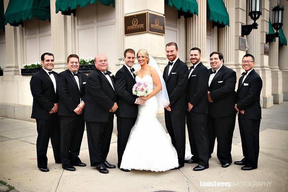 Newlyweds with groomsmen