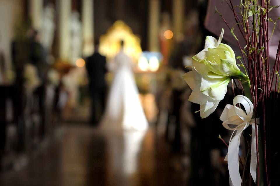 Standing near altar