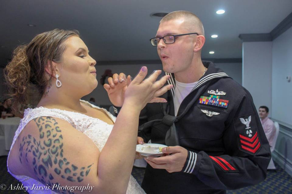 The couple sharing the wedding cake