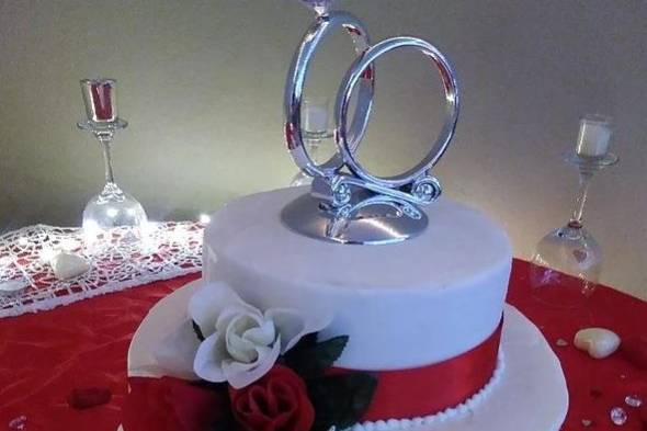 Red ribbons and ring cake topper