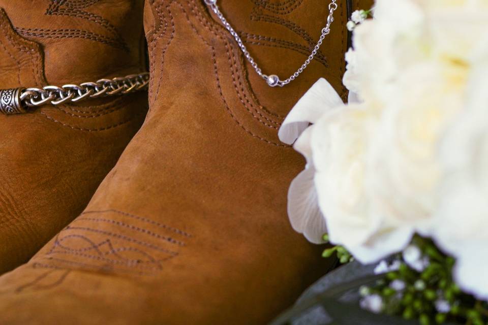 Bridal boots and a bouquet.