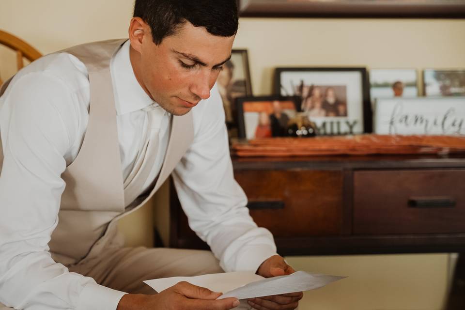 Groom Reading Letter